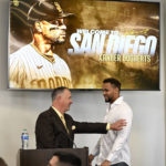 
              San Diego Padres' Xander Bogaerts, right, is welcomed by announcer Don Orsillo as he arrives at a news conference held to announce that his $280 million, 11-year contact with the Padres has been finalized, Friday, Dec. 9, 2022, in San Diego. (AP Photo/Denis Poroy)
            