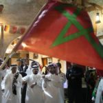 
              A man waves a Moroccan flag as people celebrate in the Souq in Doha, Qatar after Morocco beat Portugal in a World Cup quarterfinal soccer match at Al Thumama Stadium in Doha, Qatar, Saturday, Dec. 10, 2022. (AP Photo/Jorge Saenz)
            