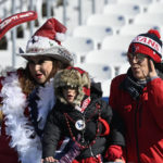 
              Fans watch teams warm up before an NFL football game between the Tennessee Titans and the Houston Texans, Saturday, Dec. 24, 2022, in Nashville, Tenn. (AP Photo/Mark Zaleski)
            