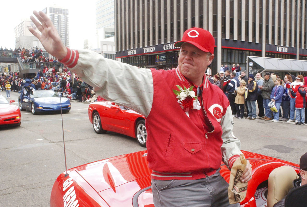 FILE - Former Cincinnati Reds pitcher Tom Browning waves during the Findlay Market Parade through d...