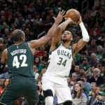 
              Milwaukee Bucks forward Giannis Antetokounmpo (34) looks to shoot as Boston Celtics center Al Horford (42) defends during the first half of an NBA basketball game, Sunday, Dec. 25, 2022, in Boston. (AP Photo/Mary Schwalm)
            