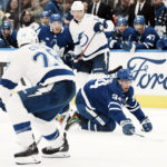 
              Toronto Maple Leafs' Auston Matthews goes after a loose puck during the second period of an NHL hockey game against the Tampa Bay Lightning, Tuesday, Dec. 20, 2022 in Toronto. (Chris Young/The Canadian Press via AP)
            