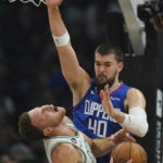 
              Los Angeles Clippers' Ivica Zubac (40) fouls Boston Celtics' Blake Griffin during the first half of an NBA basketball game, Monday, Dec. 12, 2022, in Los Angeles. (AP Photo/Jae C. Hong)
            