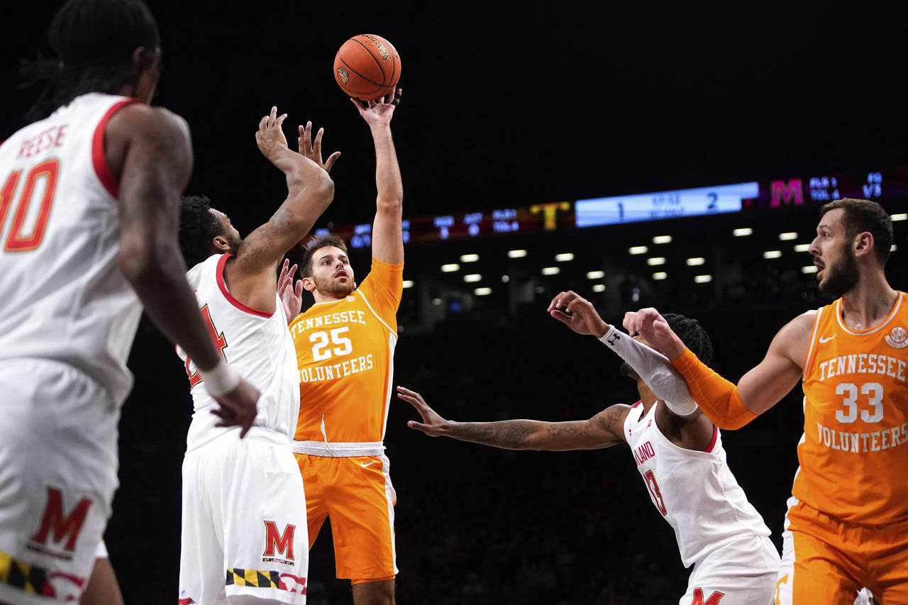 Tennessee guard Santiago Vescovi (25) goes up to shoot during the first half of an NCAA college bas...