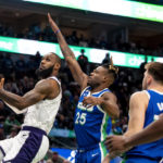 
              Los Angeles Lakers forward LeBron James drives past Dallas Mavericks forward Reggie Bullock (25) to attempt a layup in the first half of an NBA basketball game in Dallas, Sunday, Dec. 25, 2022. (AP Photo/Emil T. Lippe)
            