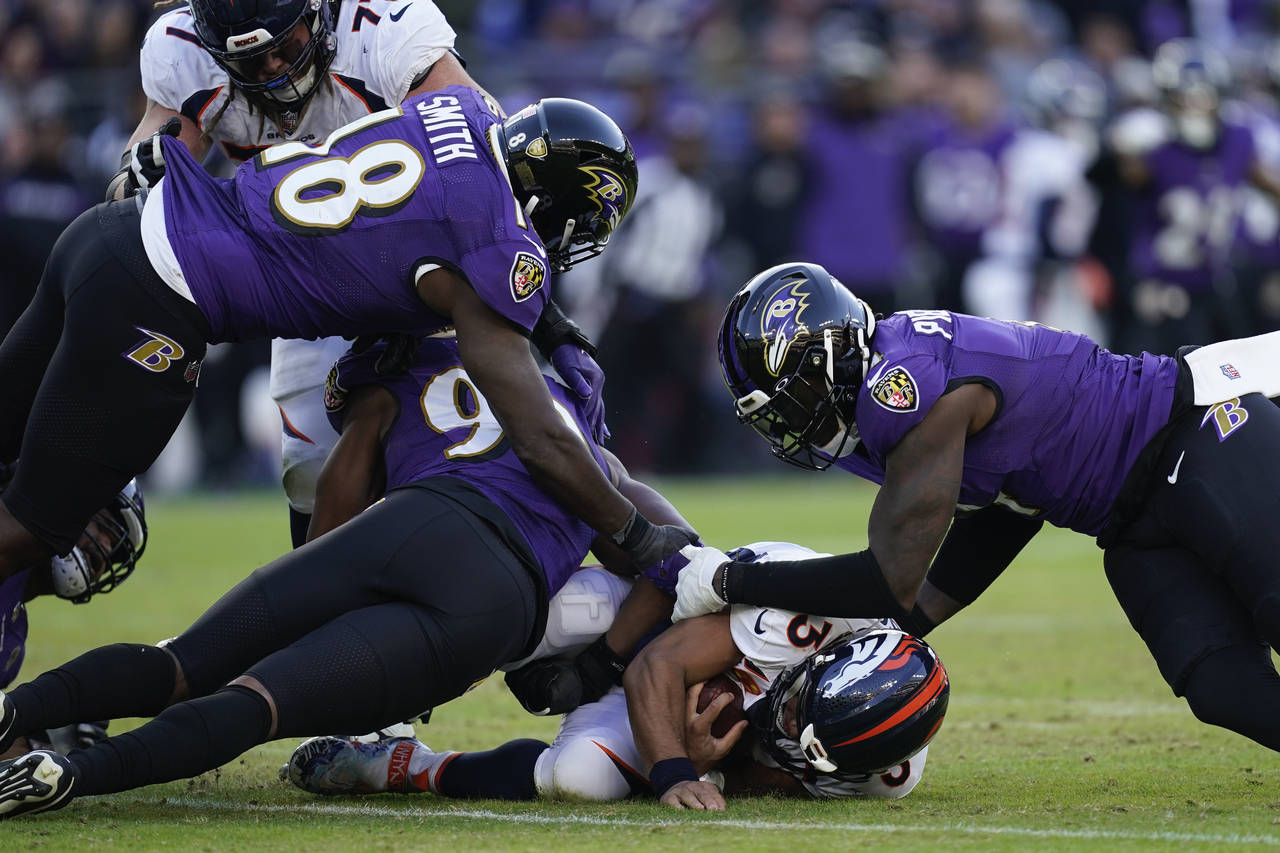 Baltimore Ravens linebacker Odafe Oweh (99) walks off the field