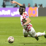 
              Croatia's Josko Gvardiol falls during the World Cup third-place playoff soccer match between Croatia and Morocco at Khalifa International Stadium in Doha, Qatar, Saturday, Dec. 17, 2022. (AP Photo/Andre Penner)
            