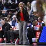 
              Associate head coach Chris Dailey calls out to her team during the first half of an NCAA college basketball game against Florida State, Sunday, Dec. 18, 2022, in Uncasville, Conn. (AP Photo/Jessica Hill)
            