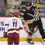 
              Pittsburgh Penguins' Sidney Crosby (87) celebrates after scoring during the first period of an NHL hockey game against the Carolina Hurricanes in Pittsburgh, Thursday, Dec. 22, 2022. (AP Photo/Gene J. Puskar)
            