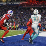 
              Miami Dolphins wide receiver Tyreek Hill (10) catches a pass from Tua Tagovailoa for a touchdown during the second half of an NFL football game against the Buffalo Bills in Orchard Park, N.Y., Saturday, Dec. 17, 2022. (AP Photo/Adrian Kraus)
            