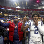 
              Jackson State head coach Deion Sanders, left, and quarterback Shedeur Sanders (2) point to the band after their overtime loss to North Carolina Central in the Celebration Bowl NCAA college football game, Saturday, Dec. 17, 2022, in Atlanta.(Jason Getz/Atlanta Journal-Constitution via AP)
            