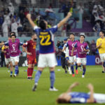 
              Japan players celebrate after defeating Spain 2-1 after the World Cup group E soccer match between Japan and Spain, at the Khalifa International Stadium in Doha, Qatar, Thursday, Dec. 1, 2022. (AP Photo/Aijaz Rahi)
            