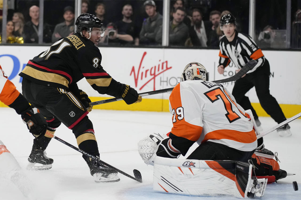Vegas Golden Knights center Jonathan Marchessault (81) scores against Philadelphia Flyers goaltende...
