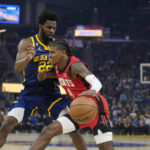 
              Houston Rockets guard Jalen Green (4) tries to get around Golden State Warriors forward Andrew Wiggins (22) during the first half of an NBA basketball game in San Francisco, Saturday, Dec. 3, 2022. (AP Photo/Godofredo A. Vásquez)
            