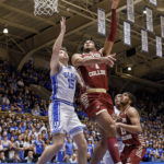 
              Boston College's T.J. Bickerstaff (1) attempts a shot as Duke's Ryan Young (15) defends during the first half of an NCAA college basketball game in Durham, N.C., Saturday, Dec. 3, 2022. (AP Photo/Ben McKeown)
            