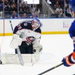 
              Columbus Blue Jackets goaltender Joonas Korpisalo (70) stops a shot by New York Islanders' Brock Nelson (29) during the second period of an NHL hockey game Thursday, Dec. 29, 2022, in Elmont, N.Y. (AP Photo/Frank Franklin II)
            