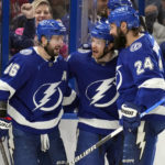 
              Tampa Bay Lightning center Brayden Point (21) celebrates his goal against the Montreal Canadiens with right wing Nikita Kucherov (86) and defenseman Zach Bogosian (24) during the second period of an NHL hockey game Wednesday, Dec. 28, 2022, in Tampa, Fla. (AP Photo/Chris O'Meara)
            
