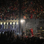 
              FILE - Morocco fans in Marseille, southern France, celebrate their victory against Spain in the World Cup round of 16 soccer match between Morocco and Spain, Tuesday, Dec. 6, 2022. (AP Photo/Daniel Cole, File)
            