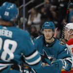 
              San Jose Sharks center Nico Sturm (7) celebrates with right wing Timo Meier after scoring a goal in the first period of an NHL hockey game against the Calgary Flames, Tuesday, Dec. 20, 2022, in San Jose, Calif. (AP Photo/Josie Lepe)
            