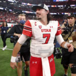 
              Utah quarterback Cameron Rising (7) walks across the field after Utah's 47-24 victory over Southern California in the Pac-12 Conference championship NCAA college football game Friday, Dec. 2, 2022, in Las Vegas. (AP Photo/Steve Marcus)
            