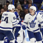 
              Toronto Maple Leafs right wing Mitchell Marner (16) celebrates his goal against the Tampa Bay Lightning with center David Kampf (64) during the second period of an NHL hockey game Saturday, Dec. 3, 2022, in Tampa, Fla. (AP Photo/Chris O'Meara)
            
