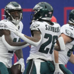 
              Philadelphia Eagles wide receiver A.J. Brown (11) celebrates with running back Miles Sanders (26) after scoring a touchdown against the New York Giants during the second quarter of an NFL football game, Sunday, Dec. 11, 2022, in East Rutherford, N.J. (AP Photo/Bryan Woolston)
            