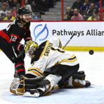 
              Ottawa Senators right wing Alex DeBrincat (12) watches his shot go in the net behind Boston Bruins goaltender Jeremy Swayman (1) during the second period of an NHL hockey game in Ottawa, Ontario, on Tuesday, Dec. 27, 2022. (Justin Tang/The Canadian Press via AP)
            