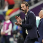 
              England's head coach Gareth Southgate applauds during the World Cup quarterfinal soccer match between England and France, at the Al Bayt Stadium in Al Khor, Qatar, Saturday, Dec. 10, 2022. (AP Photo/Frank Augstein)
            