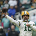 
              Green Bay Packers quarterback Aaron Rodgers (12) passes during the first half of an NFL football game against the Miami Dolphins, Sunday, Dec. 25, 2022, in Miami Gardens, Fla. (AP Photo/Jim Rassol)
            