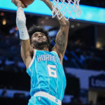 
              Charlotte Hornets forward Jalen McDaniels (6) drives to the basket during the first half of an NBA basketball game against the Oklahoma City Thunder, Thursday, Dec. 29, 2022, in Charlotte, N.C. (AP Photo/Rusty Jones)
            
