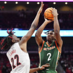 
              Florida A&M guard Jordan Chatman (2) shoots over Louisville forward Kamari Lands (22) during the first half of an NCAA college basketball game in Louisville, Ky., Saturday, Dec. 17, 2022. (AP Photo/Timothy D. Easley)
            