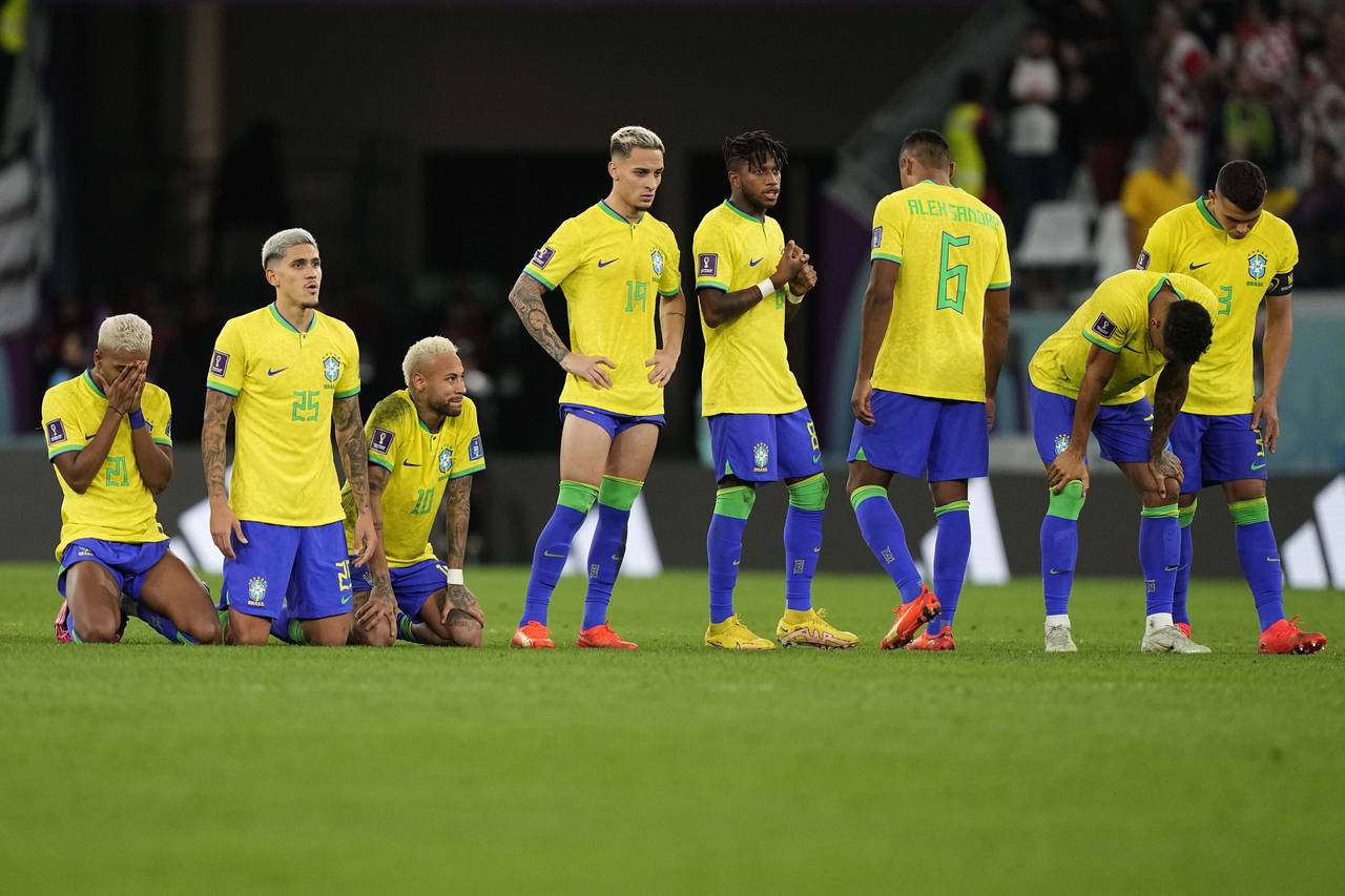 Brazil players react during the penalty shootout at the World Cup quarterfinal soccer match between...