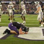 
              TCU quarterback Max Duggan (15) kneels in the end zone after rushing for a touchdown in the second half of the Big 12 Conference championship NCAA college football game against Kansas State, Saturday, Dec. 3, 2022, in Arlington, Texas. (AP Photo/LM Otero)
            