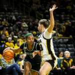 
              Dartmouth guard Karina Mitchell, left, drives to the basket as Iowa guard Kate Martin defends during an NCAA college basketball game against Dartmouth, Wednesday, Dec. 21, 2022, at Carver-Hawkeye Arena in Iowa City, Iowa. (Joseph Cress/Iowa City Press-Citizen via AP)
            