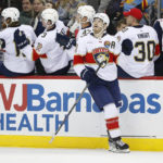 
              Florida Panthers left wing Matthew Tkachuk (19) looks at the scoreboard after scoring a goal against the New Jersey Devils during the first period of an NHL hockey game, Saturday Dec. 17, 2022, in Newark, N.J. (AP Photo/Noah K. Murray)
            