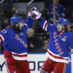 
              New York Rangers center Mika Zibanejad, left, congratulates Artemi Panarin after Panarin's goal against the New York Islanders during the first period of an NHL hockey game Thursday, Dec. 22, 2022, in New York. (AP Photo/John Munson)
            