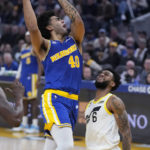 
              Golden State Warriors forward Anthony Lamb (40) shoots over Utah Jazz guard Nickeil Alexander-Walker (6) during the first half of an NBA basketball game in San Francisco, Wednesday, Dec. 28, 2022. (AP Photo/Jeff Chiu)
            
