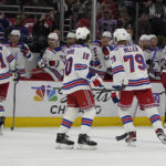 
              New York Rangers defenseman Jacob Trouba (8), back right, celebrates his goal against the Chicago Blackhawks during the second period of an NHL hockey game Sunday, Dec. 18, 2022, in Chicago. (AP Photo/David Banks)
            