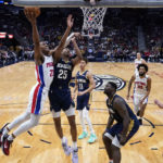 
              Detroit Pistons guard Jaden Ivey (23) goes to the basket against New Orleans Pelicans guard Trey Murphy III (25) in the first half of an NBA basketball game in New Orleans, Wednesday, Dec. 7, 2022. (AP Photo/Gerald Herbert)
            