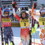 
              Switzerland's Wendy Holdener, center, winner of an alpine ski, women's World Cup slalom, celebrates with second-placed United States' Mikaela Shiffrin, left, and third-placed Slovakia's Petra Vlhova, in Sestriere, Italy, Sunday, Dec.11, 2022. (AP Photo/Alessandro Trovati)
            
