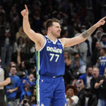
              Dallas Mavericks guard Luka Doncic (77) celebrates scoring the game tying basket during the fourth quarter of the team's NBA basketball game against the New York Knicks in Dallas, Tuesday, Dec. 27, 2022. The Mavericks won in overtime, 126-121. (AP Photo/LM Otero)
            