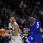 
              Purdue forward Mason Gillis (0) looks to pass the ball around New Orleans forward Tyson Jackson (5) during the second half of an NCAA college basketball game in West Lafayette, Ind., Wednesday, Dec. 21, 2022. (AP Photo/Michael Conroy)
            