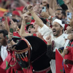 
              Morocco fans celebrate during the World Cup group F soccer match between Canada and Morocco at the Al Thumama Stadium in Doha , Qatar, Thursday, Dec. 1, 2022. (AP Photo/Natacha Pisarenko)
            