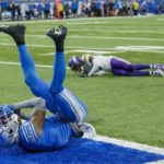 
              Detroit Lions' DJ Chark catches a touchdown pass in front of Minnesota Vikings' Cameron Dantzler Sr. during the first half of an NFL football game Sunday, Dec. 11, 2022, in Detroit. (AP Photo/Duane Burleson)
            