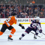 
              Columbus Blue Jackets' Johnny Gaudreau, right, tries to get past Philadelphia Flyers' Noah Cates during the third period of an NHL hockey game, Tuesday, Dec. 20, 2022, in Philadelphia. (AP Photo/Matt Slocum)
            