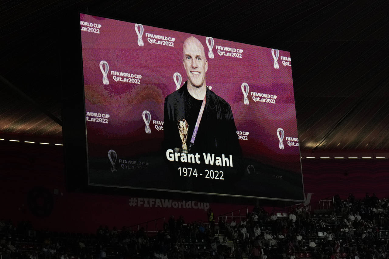 A tribute to journalist Grant Wahl is show on a screen before the World Cup quarterfinal soccer mat...