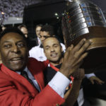 
              FILE - Former Brazilian soccer player Pele, left, celebrates at the end of the Copa Libertadores soccer final match between Brazil's Santos and Uruguay's Penarol in Sao Paulo, Brazil, June 22, 2011. Santos won 2-1. Pelé, the Brazilian king of soccer who won a record three World Cups and became one of the most commanding sports figures of the last century, died in Sao Paulo on Thursday, Dec. 29, 2022. He was 82. (AP Photo/Andre Penner, File)
            