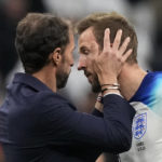 
              England's head coach Gareth Southgate talks to Harry Kane after the World Cup quarterfinal soccer match between England and France, at the Al Bayt Stadium in Al Khor, Qatar, Sunday, Dec. 11, 2022. (AP Photo/Frank Augstein)
            