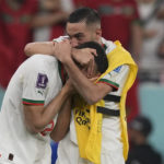 
              Morocco's Hakim Ziyech, right, and Morocco's Achraf Hakimi celebrate at the end of the World Cup group F soccer match between Canada and Morocco at the Al Thumama Stadium in Doha , Qatar, Thursday, Dec. 1, 2022. (AP Photo/Frank Augstein)
            