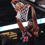 
              Toronto Raptors forward Thaddeus Young dunks against the Phoenix Suns during second-half NBA basketball game action in Toronto, Friday, Dec. 30, 2022. (Frank Gunn/The Canadian Press via AP)
            